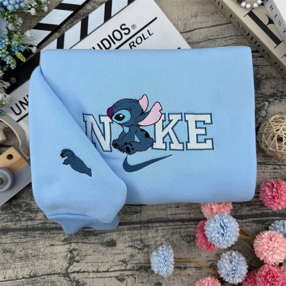 Nike Light Blue Sweatshirt with Character Design